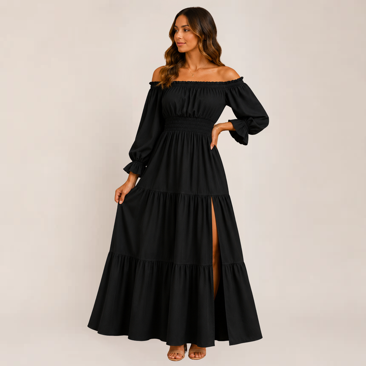 Female model showcasing a layered off-shoulder dress on a plain background.