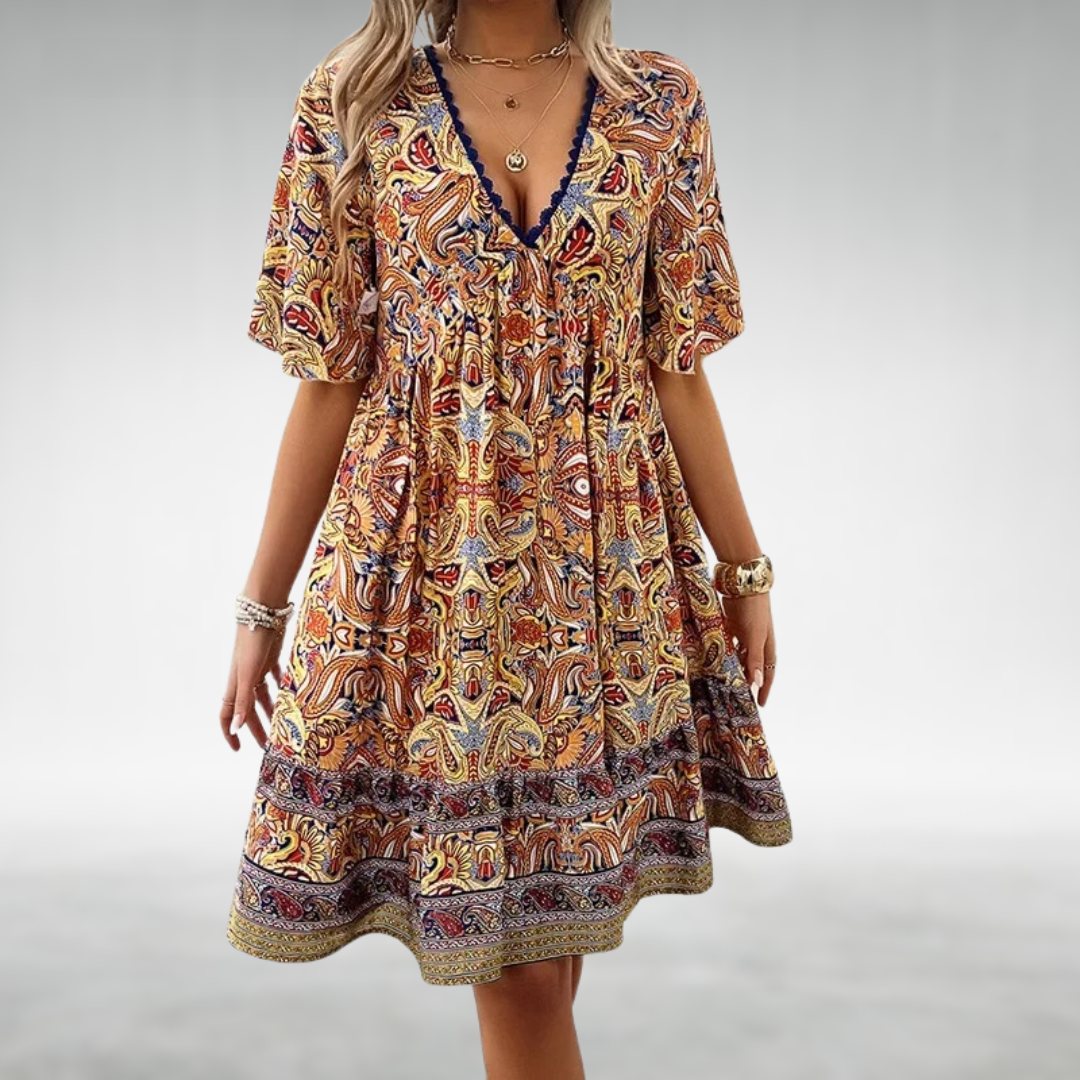 Women’s boho mini dress with colorful paisley print for summer outings.