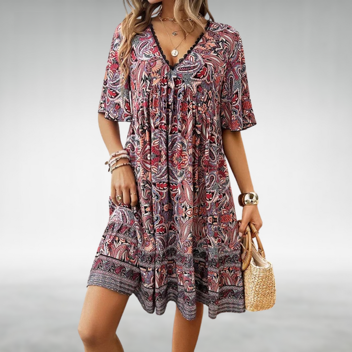 Women’s summer mini dress with vibrant paisley pattern and relaxed fit.