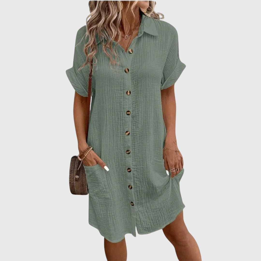  Woman wearing a flowing dress with a refined everyday look.
