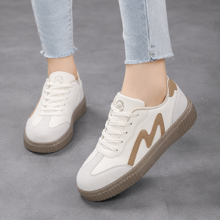 Women’s casual walking shoes on a plain background with a clean everyday style.