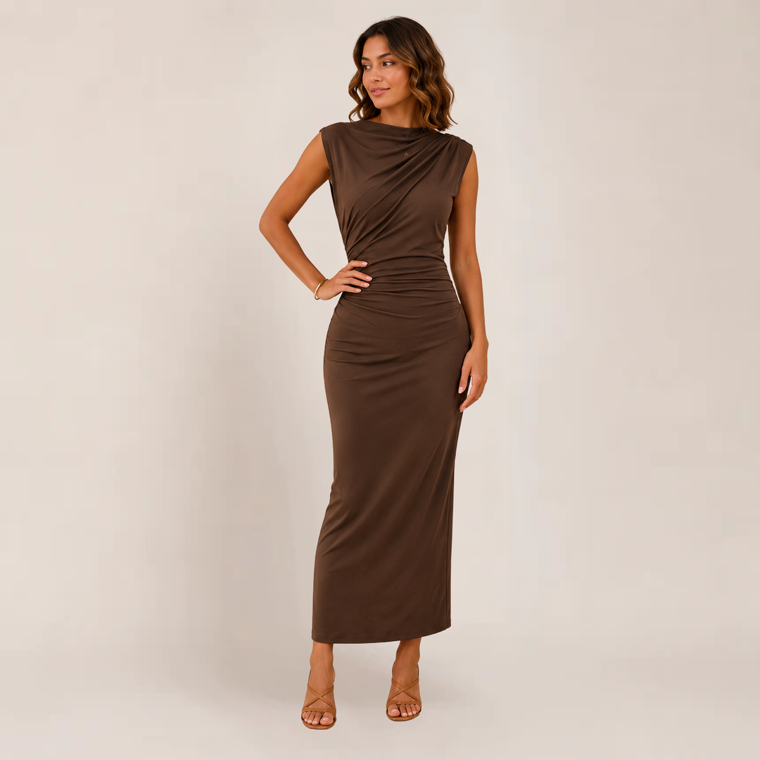 Woman wearing a fitted occasion dress on a plain background.