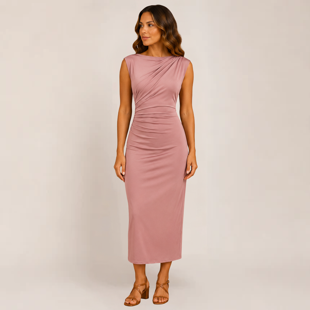 Woman in a sleek dress with clean lines on a plain background.