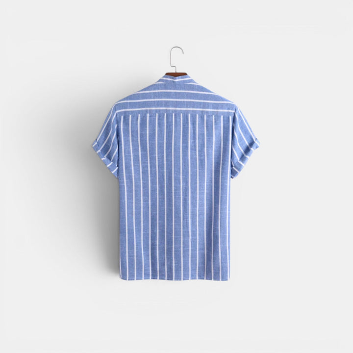 A casual collared linen shirt against a plain background.
