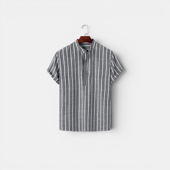A breathable collared top with a plain background.