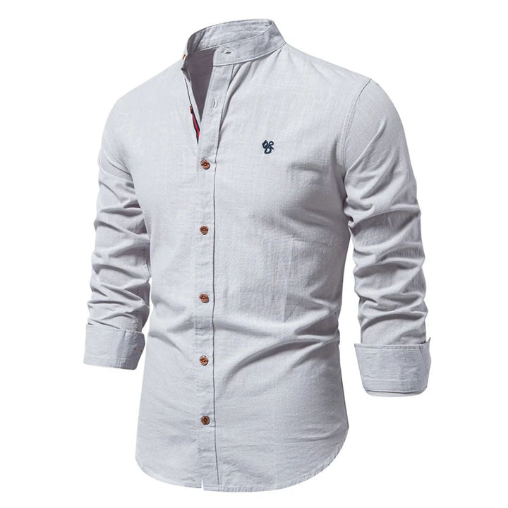 A casual button-front shirt with a modern collar on a plain background.