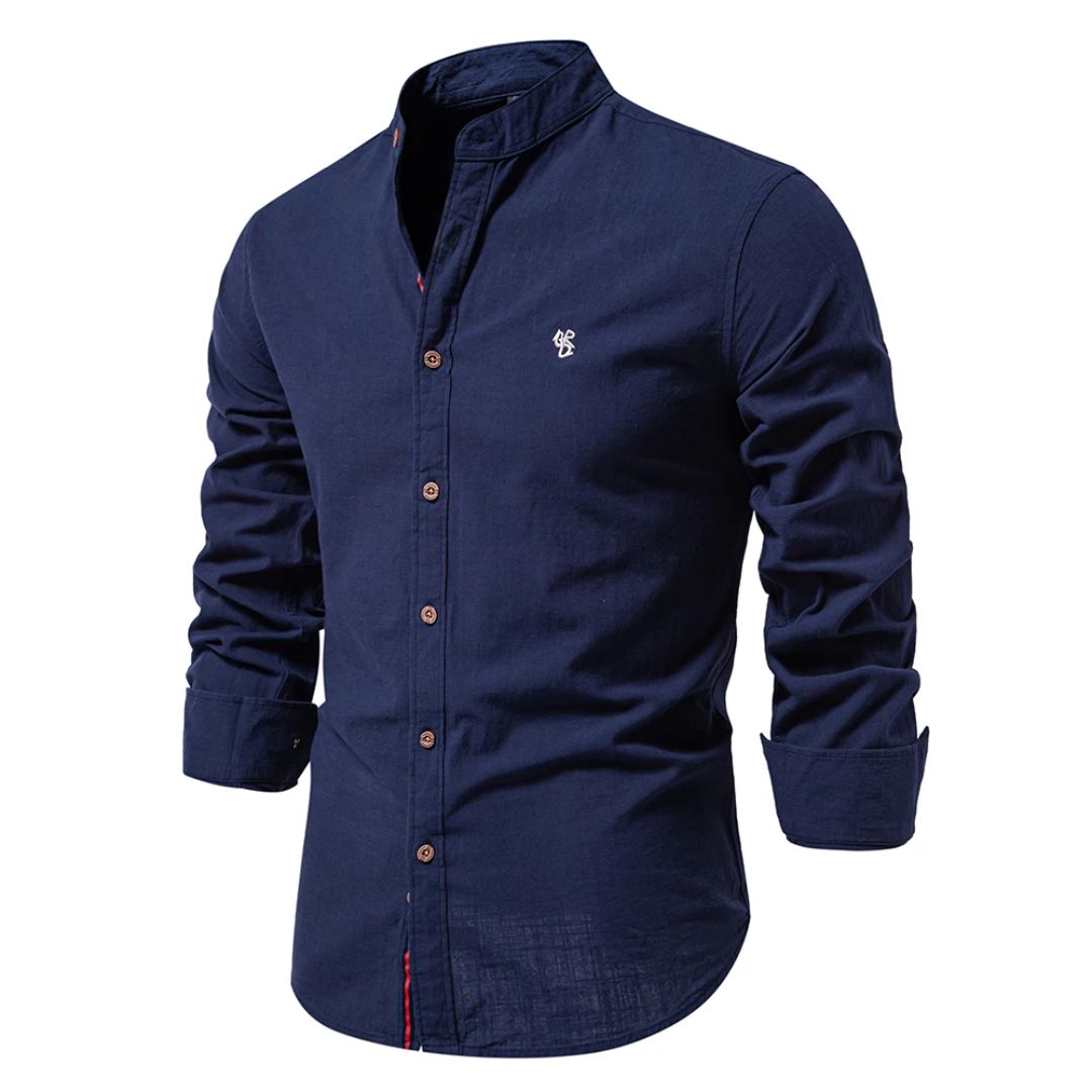 A long sleeve button-up shirt with a stand collar against a plain background.
