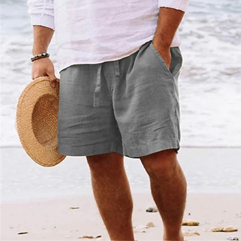  Casual men’s warm-weather shorts with pockets displayed on a plain background.