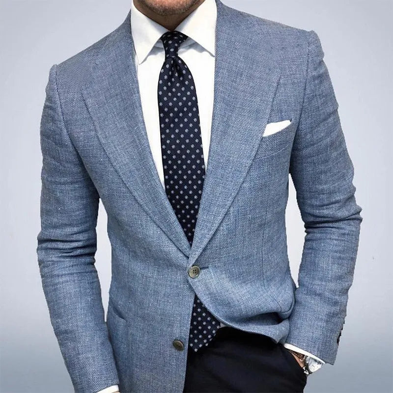  Man showcasing a lightweight textured blazer with a structured silhouette on a plain background.