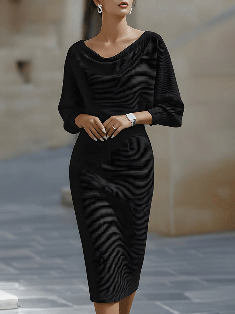 Female model in a white cowl neck midi dress with tapered waist on a plain background.