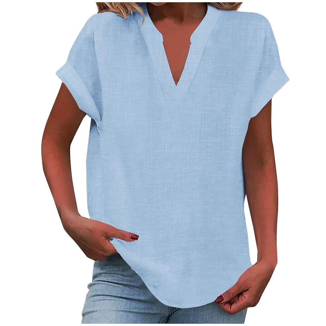 Flattering V-neck blouse presented on a clean background with airy feminine detail.