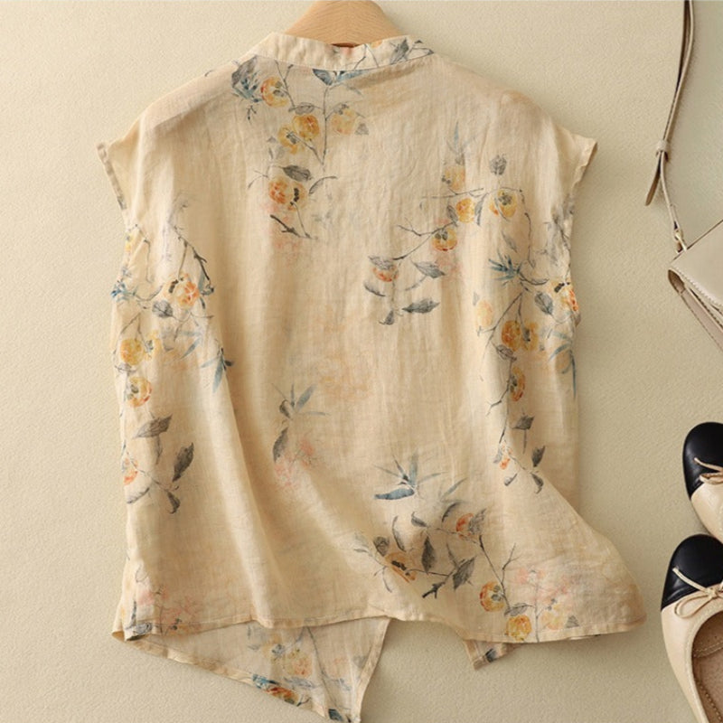 Vintage-style sleeveless top displayed on a plain background with soft feminine back angle details