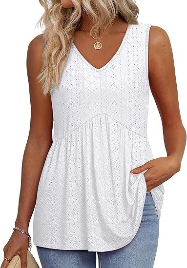 Soft relaxed women’s top displayed on a plain background with graceful styling.