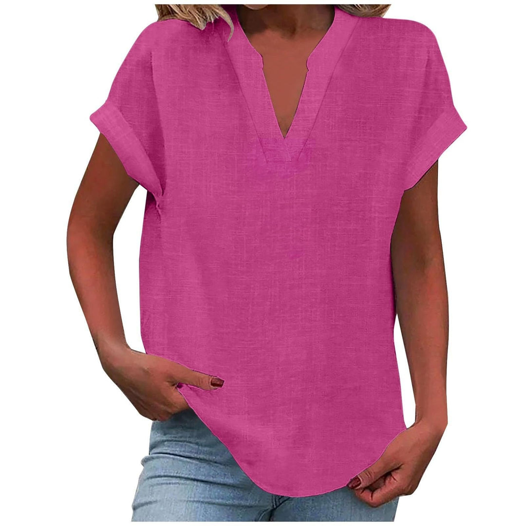 Flattering casual blouse presented against a plain background with graceful feminine style.