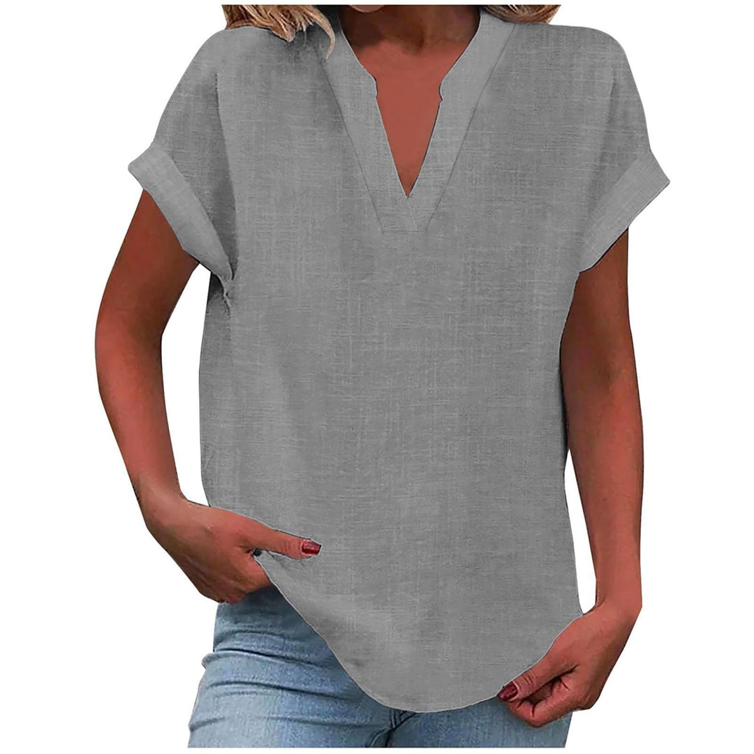 Soft flowing women’s top shown on a clean background with timeless V-neck design.