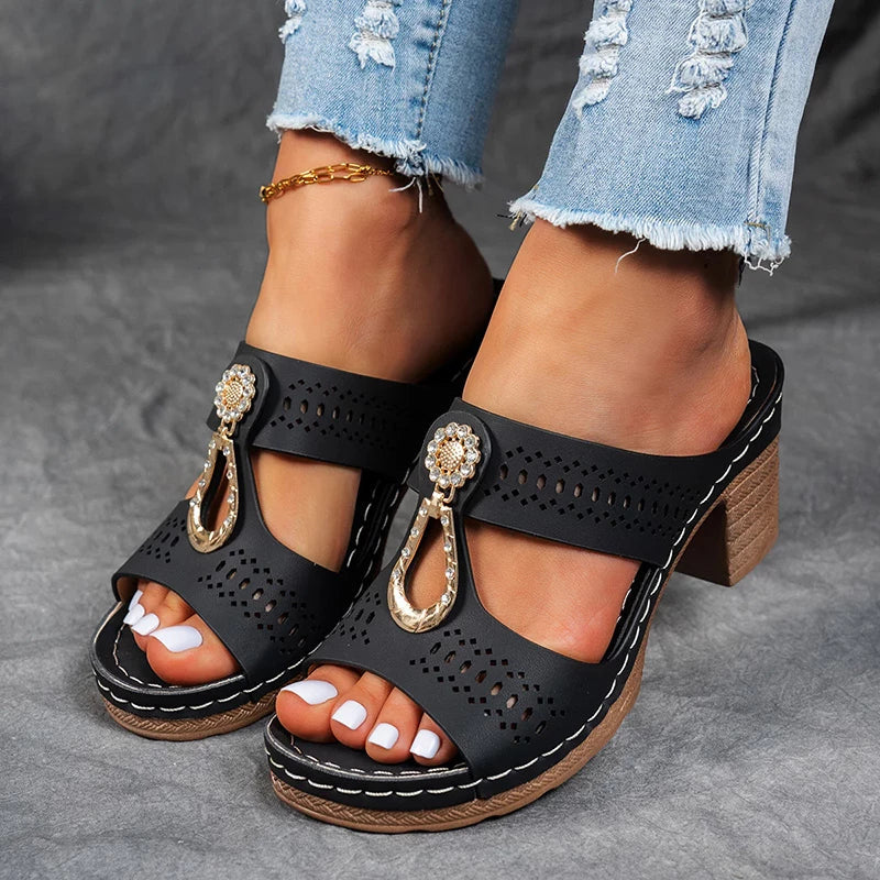 Slip-on wedge sandal with open design and supportive sole on a clean background.