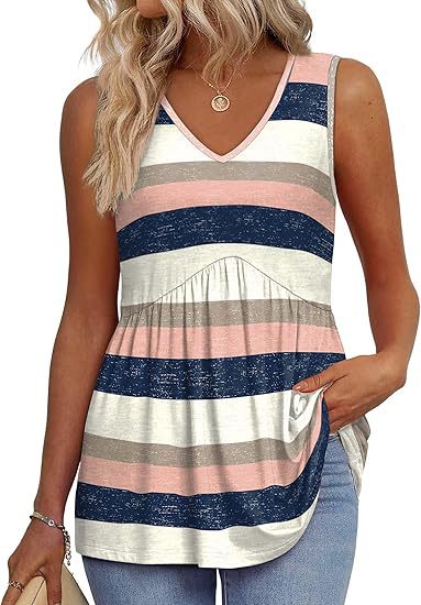 Relaxed women’s top worn with a plain background and soft feminine silhouette.