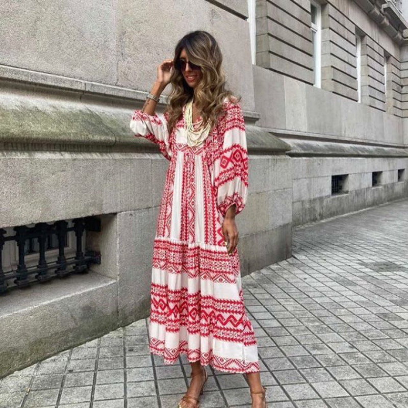 Female model wearing a lightweight long sleeve maxi dress with flowing skirt.