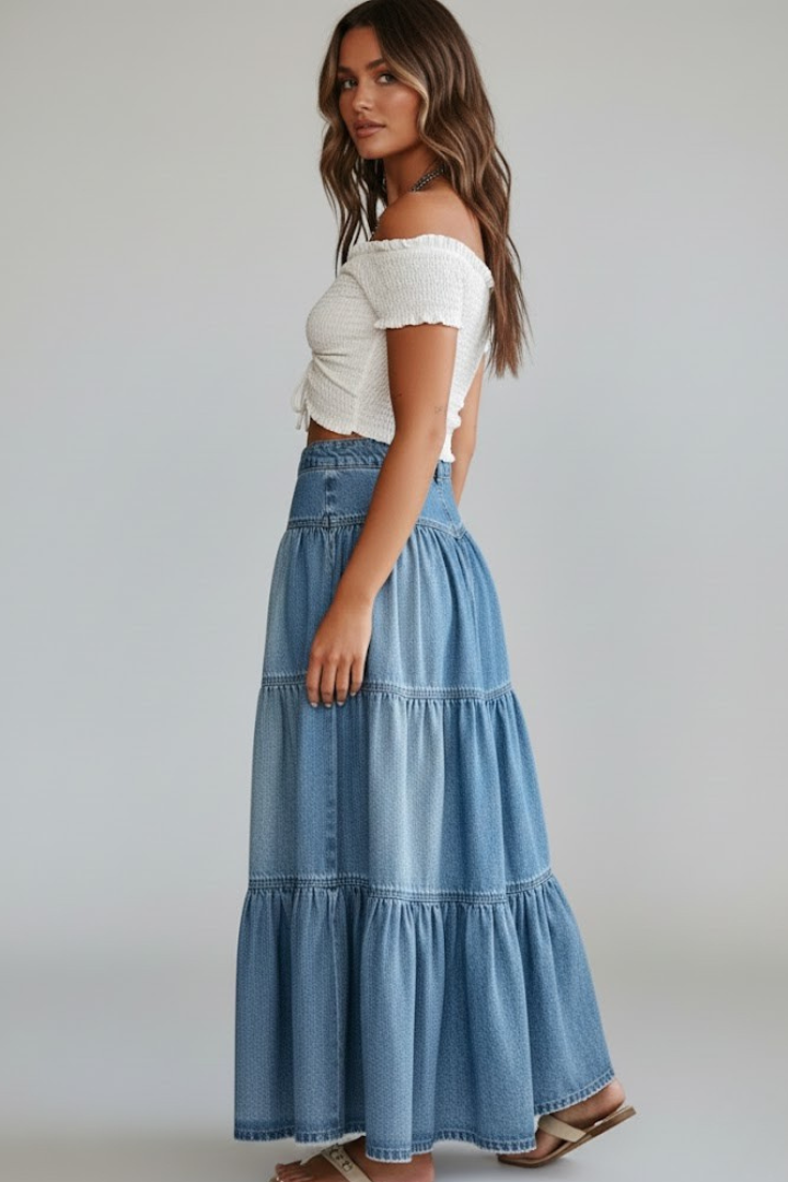 Side angle button-front long denim skirt displayed on white