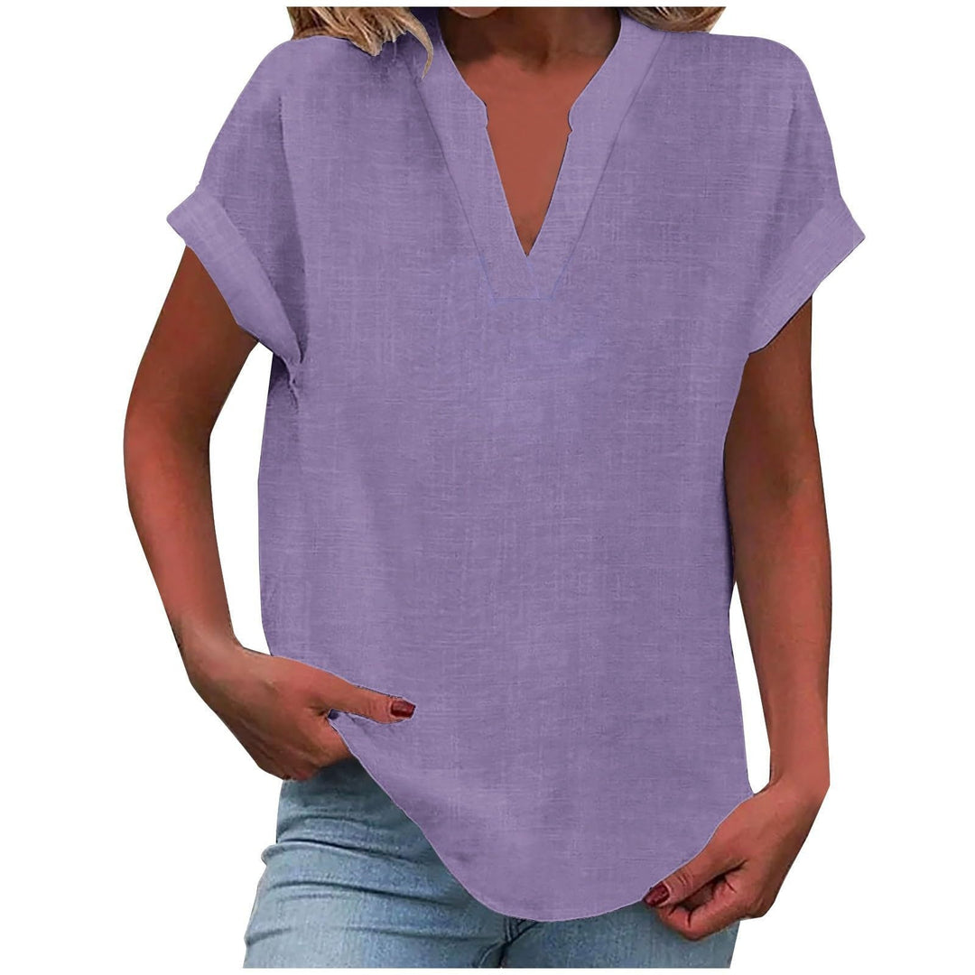 Elegant V-neck blouse displayed against a clean background with a relaxed flowing fit.