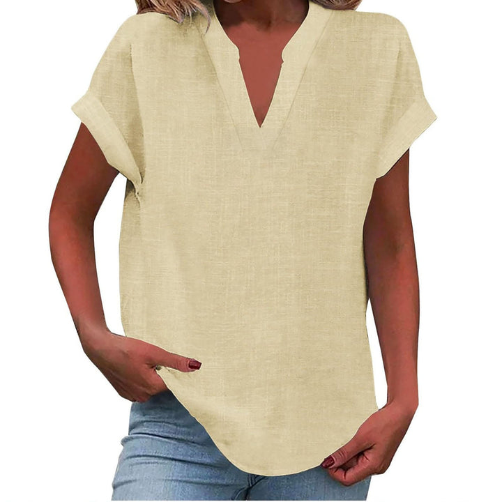Chic women’s V-neck blouse displayed on a clean background with comfortable draped fabric.