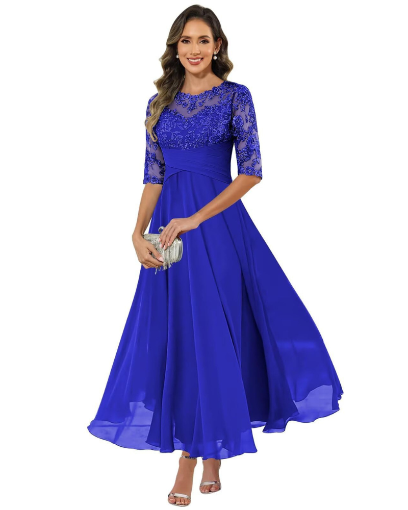 Female model wearing a graceful evening dress with textured details.