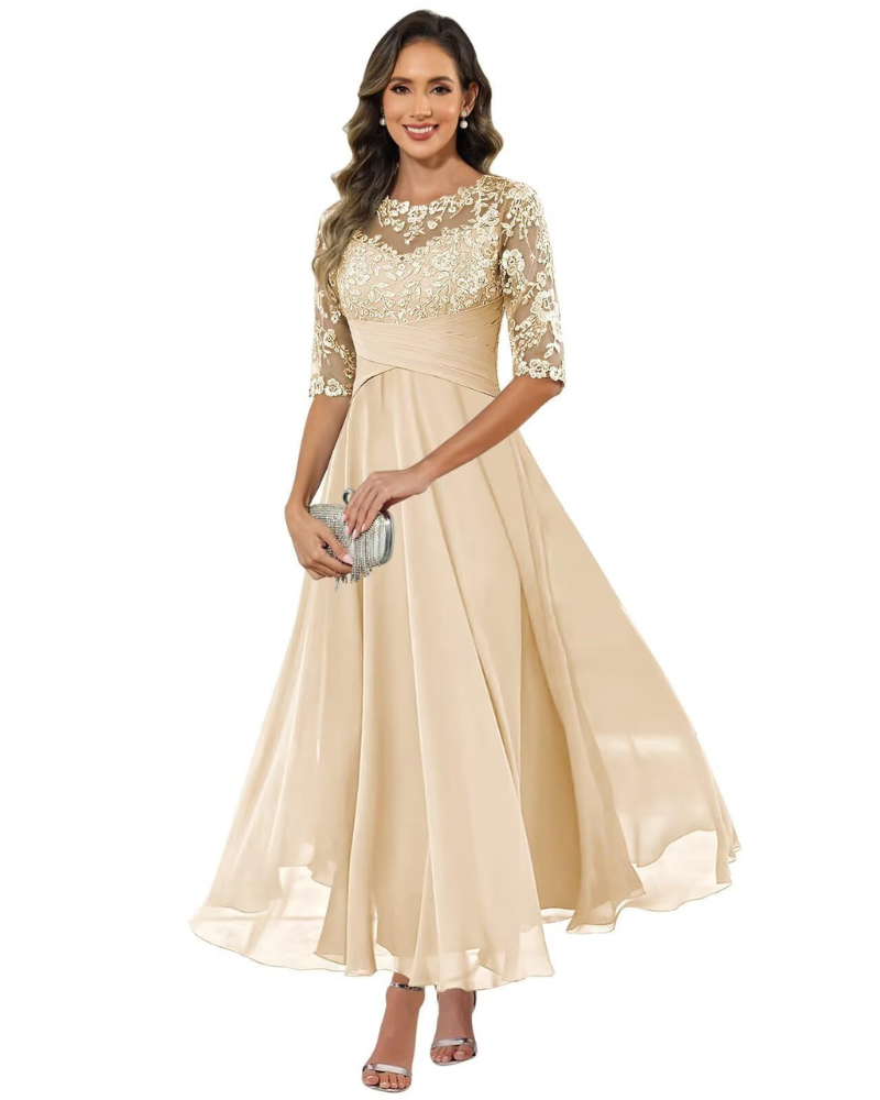 Woman wearing a polished celebration dress against a plain background.