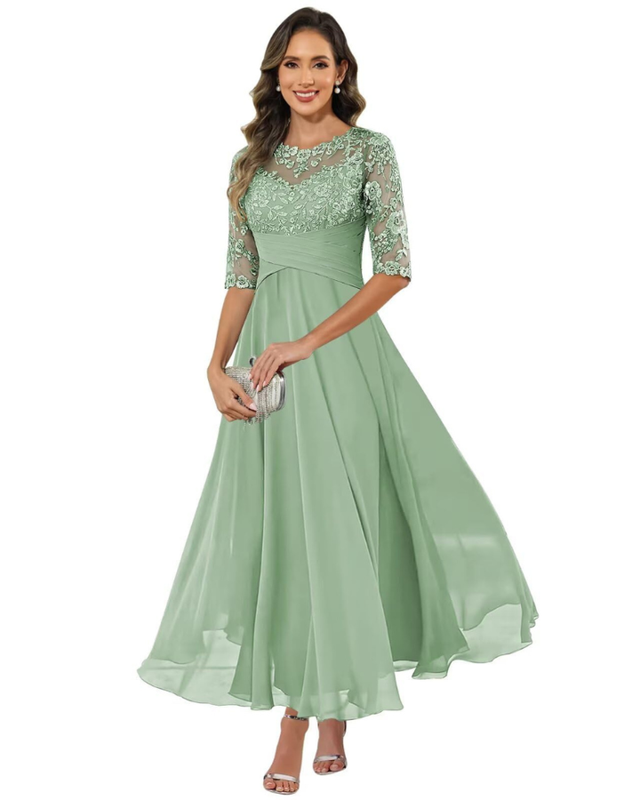 Female model wearing an occasion dress with delicate textured accents.
