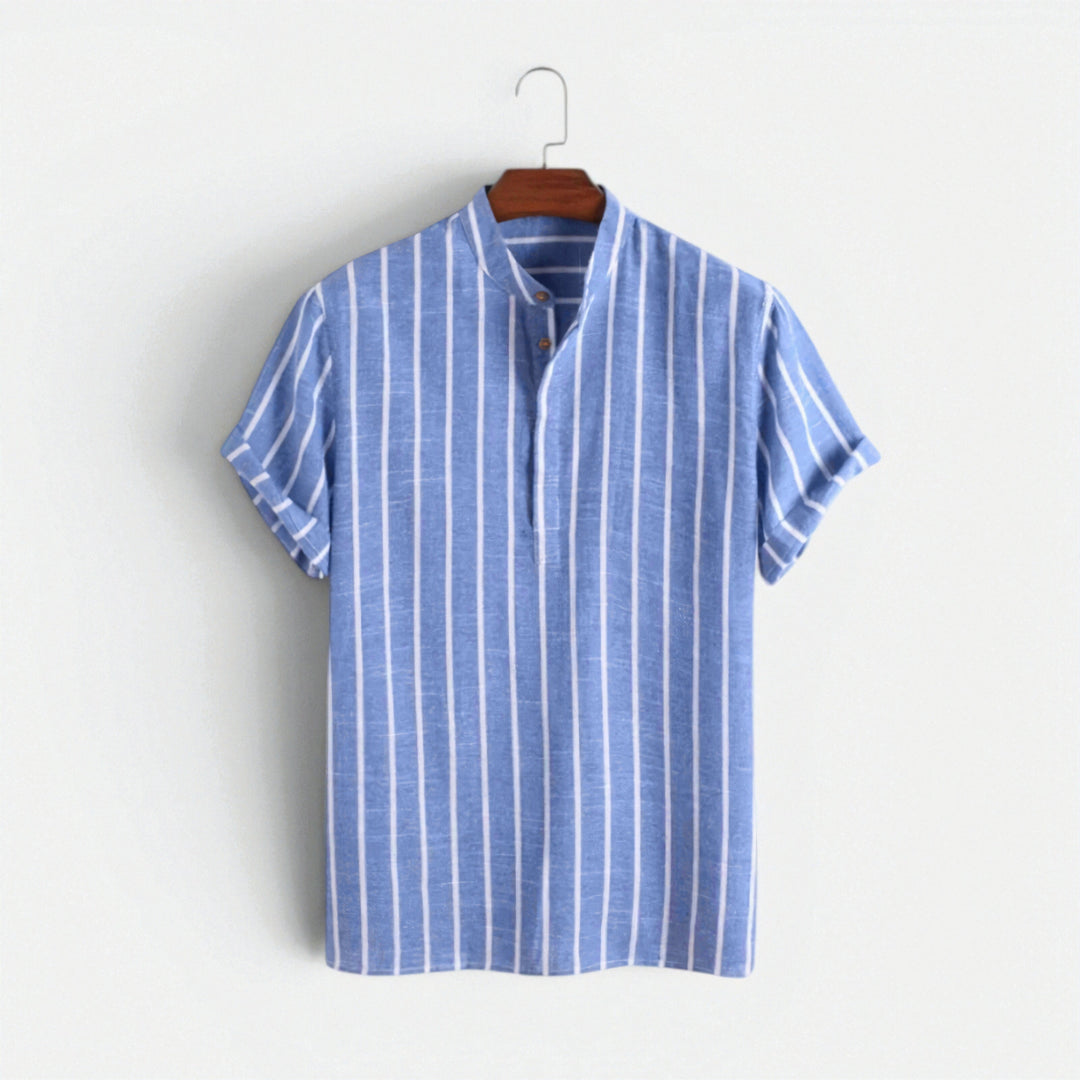 A relaxed fit linen polo top displayed on a plain background.