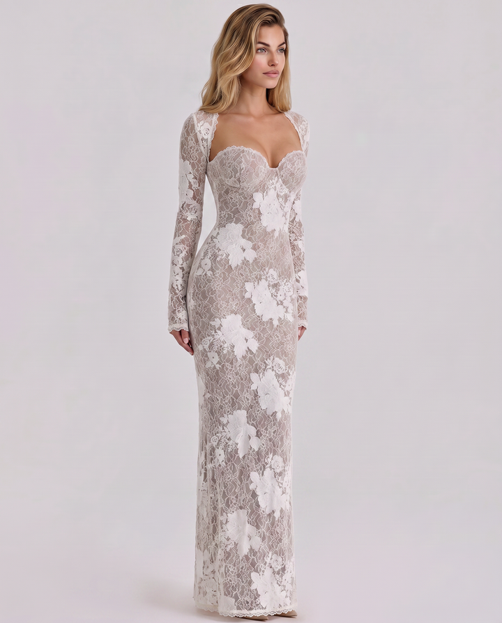 Woman wearing a long lace dress with sheer sleeves 