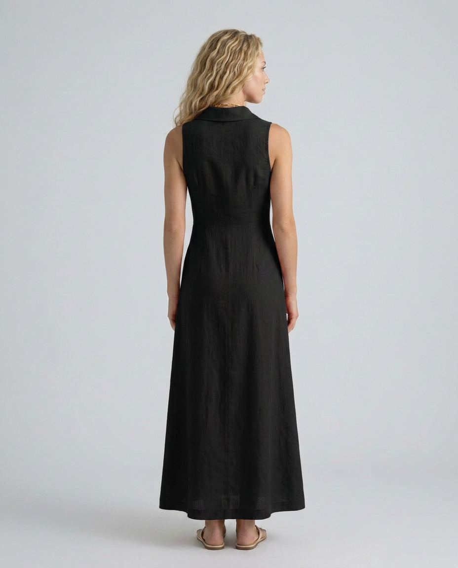  Female model showcasing a collared button-front maxi dress on a plain background.