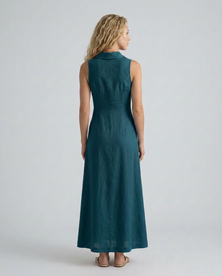  Model wearing a sleeveless button-front dress with a relaxed drape on a plain background.