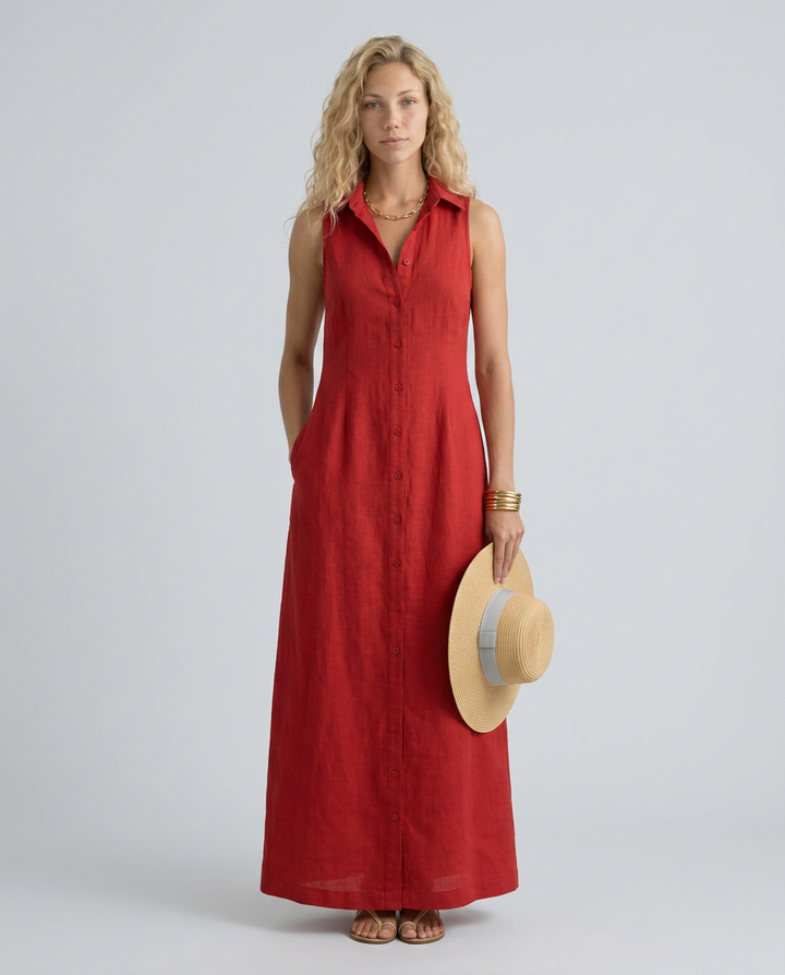  Female showcasing a casual maxi shirt dress with side pockets on a plain background.