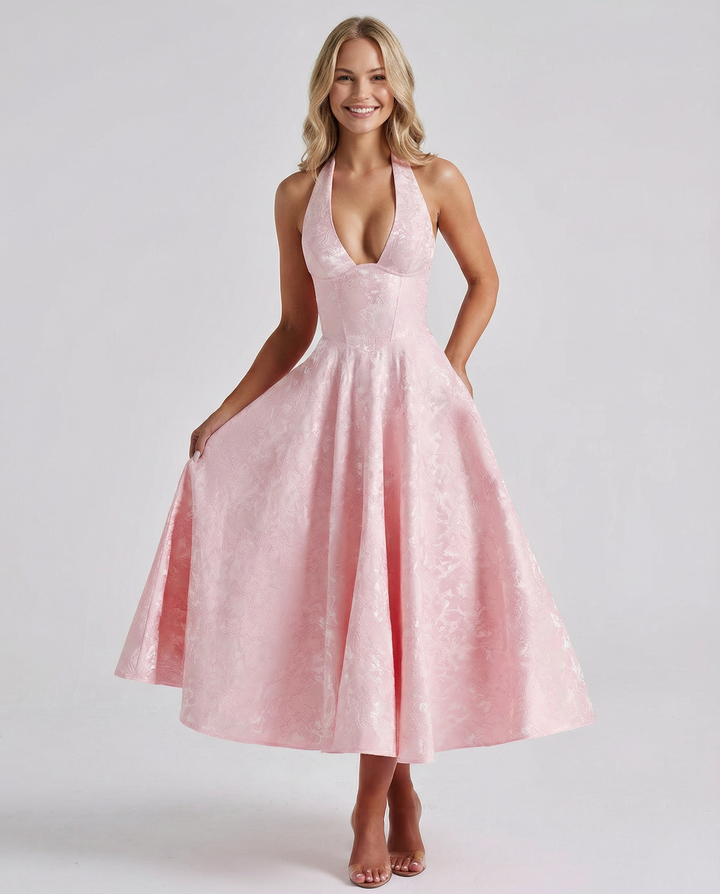 Female model wearing a woven jacquard midi dress with a structured bodice and full skirt.