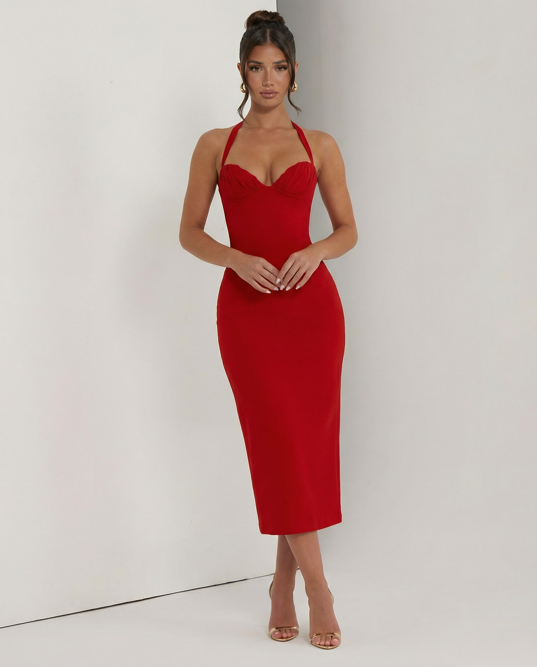 Woman wearing a evening dress with a soft draped neckline.