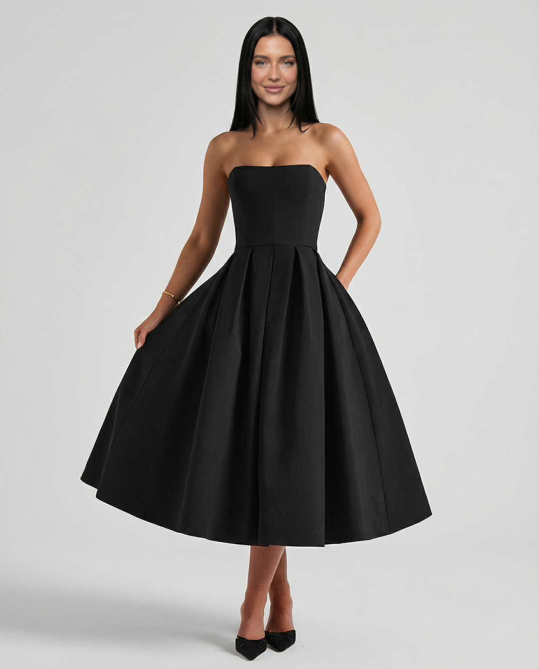 Model wearing a formal dress against a plain background.