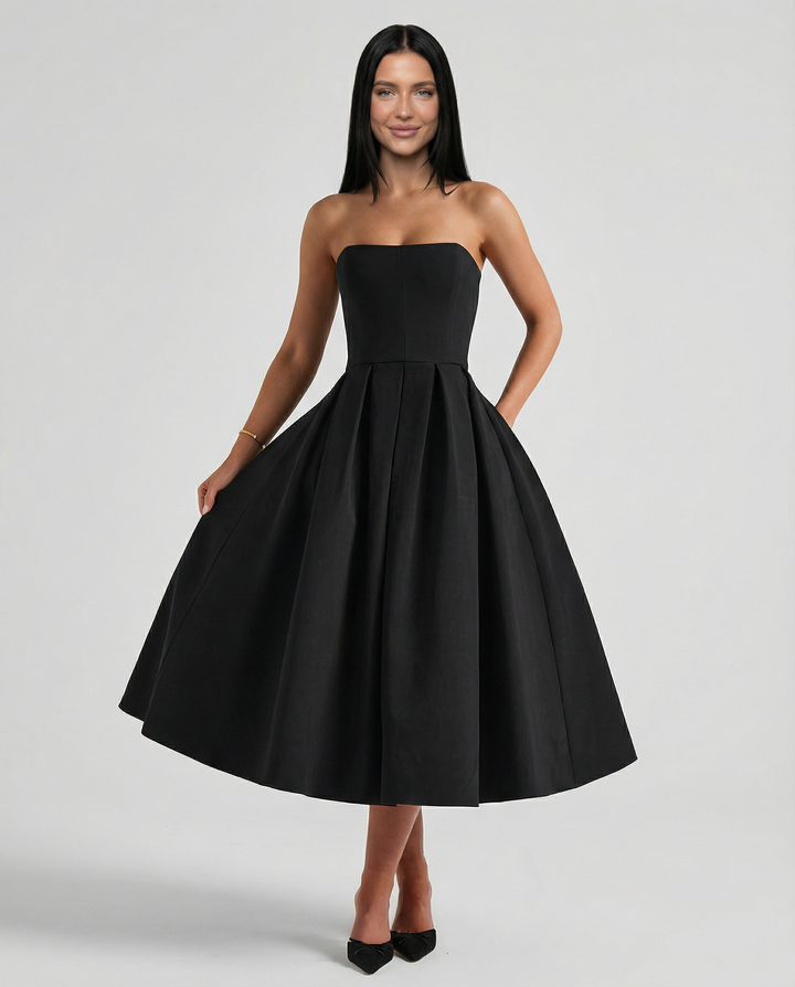 Model wearing a formal dress against a plain background.