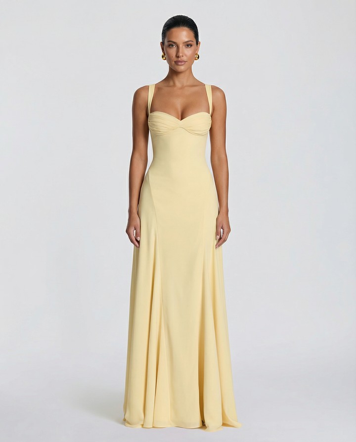Female wearing a fitted floral appliqué maxi dress with sweetheart neckline against a plain background.