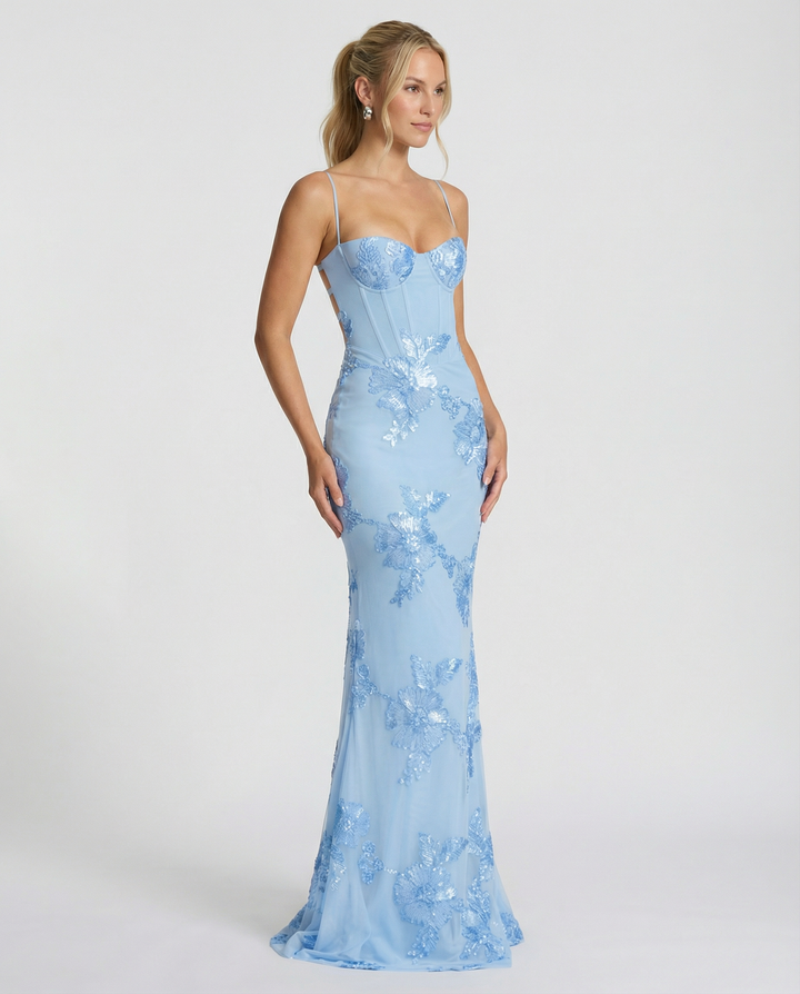 Female in a sleeveless floral detail dress