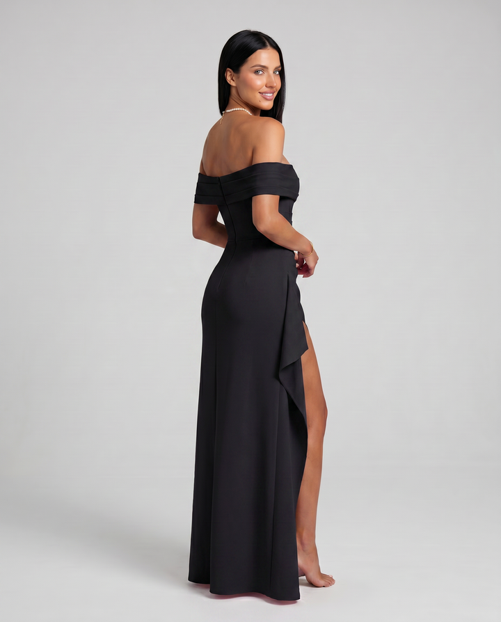 Model wearing a bodycon off shoulder dress against a plain background.