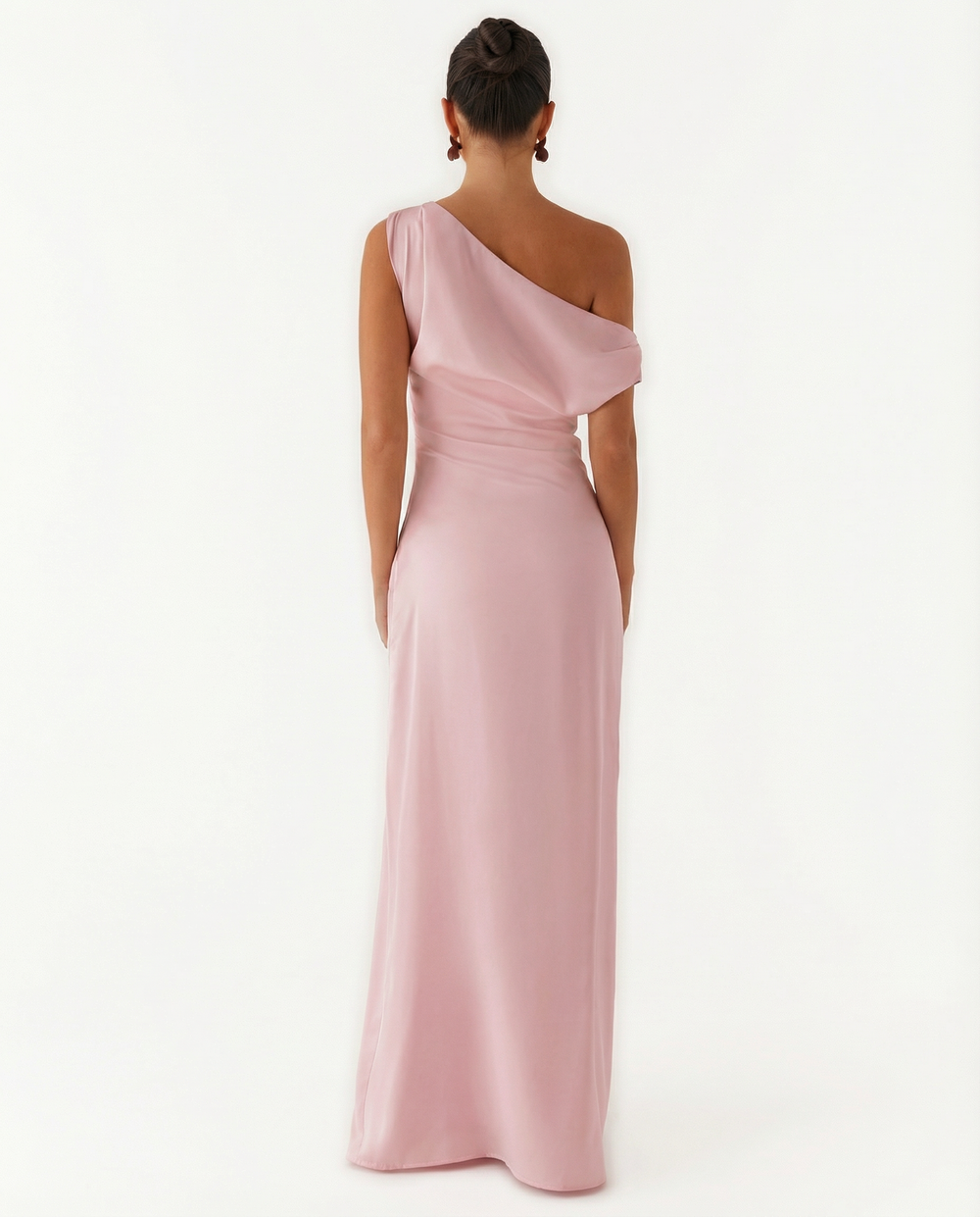Woman in a sleeveless satin maxi dress with a draped bodice on a plain background.