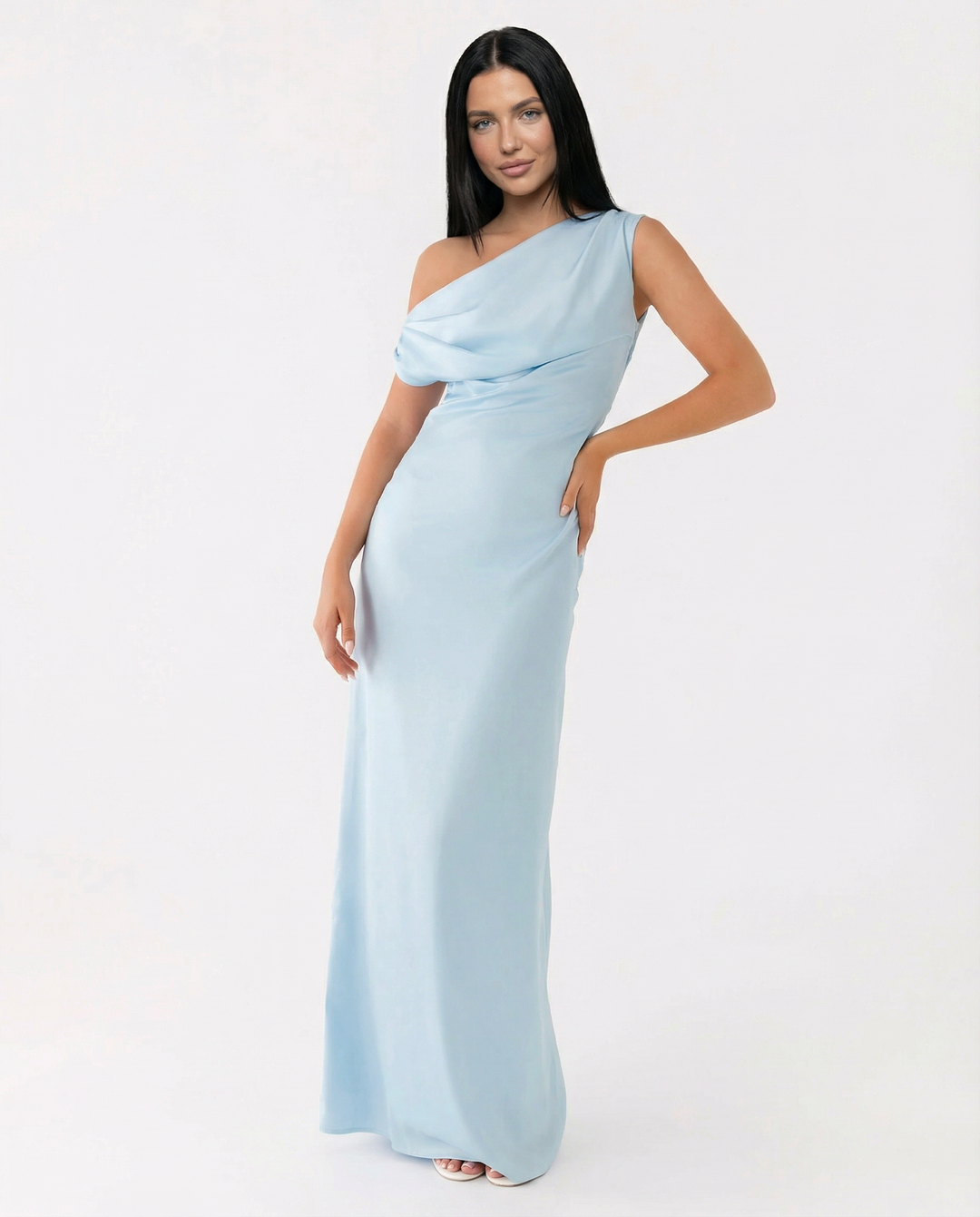 Woman in a structured waist maxi dress on a plain background.