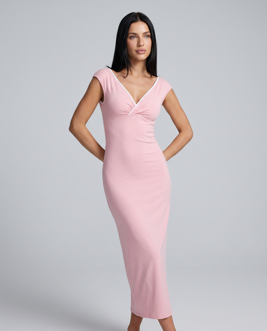 Female model wearing a pink evening maxi dress with fitted bodice on a plain background.