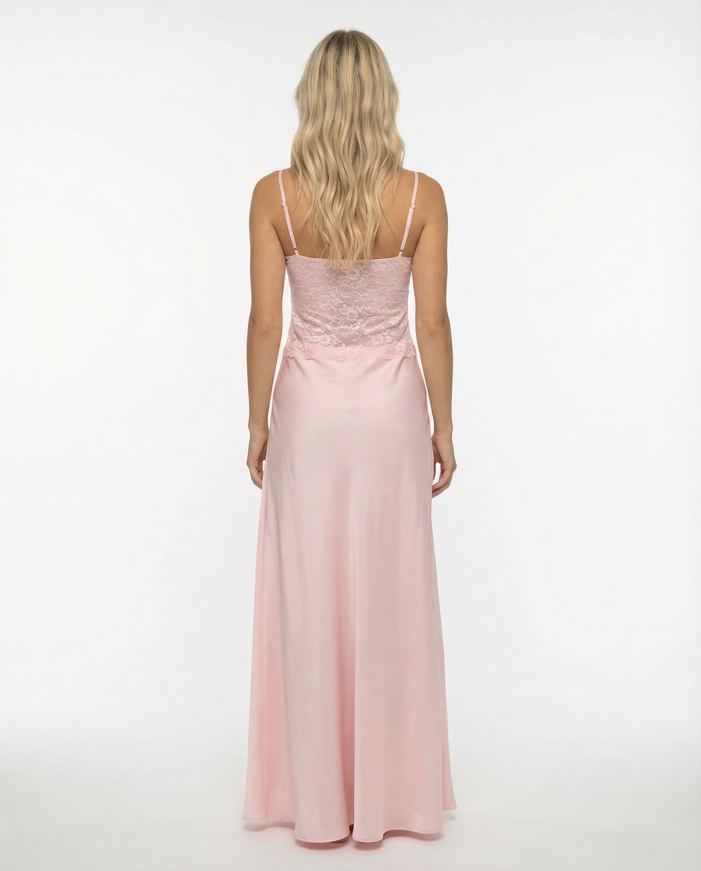 Female model in a yellow maxi dress with adjustable straps and a flowing skirt on a plain background.