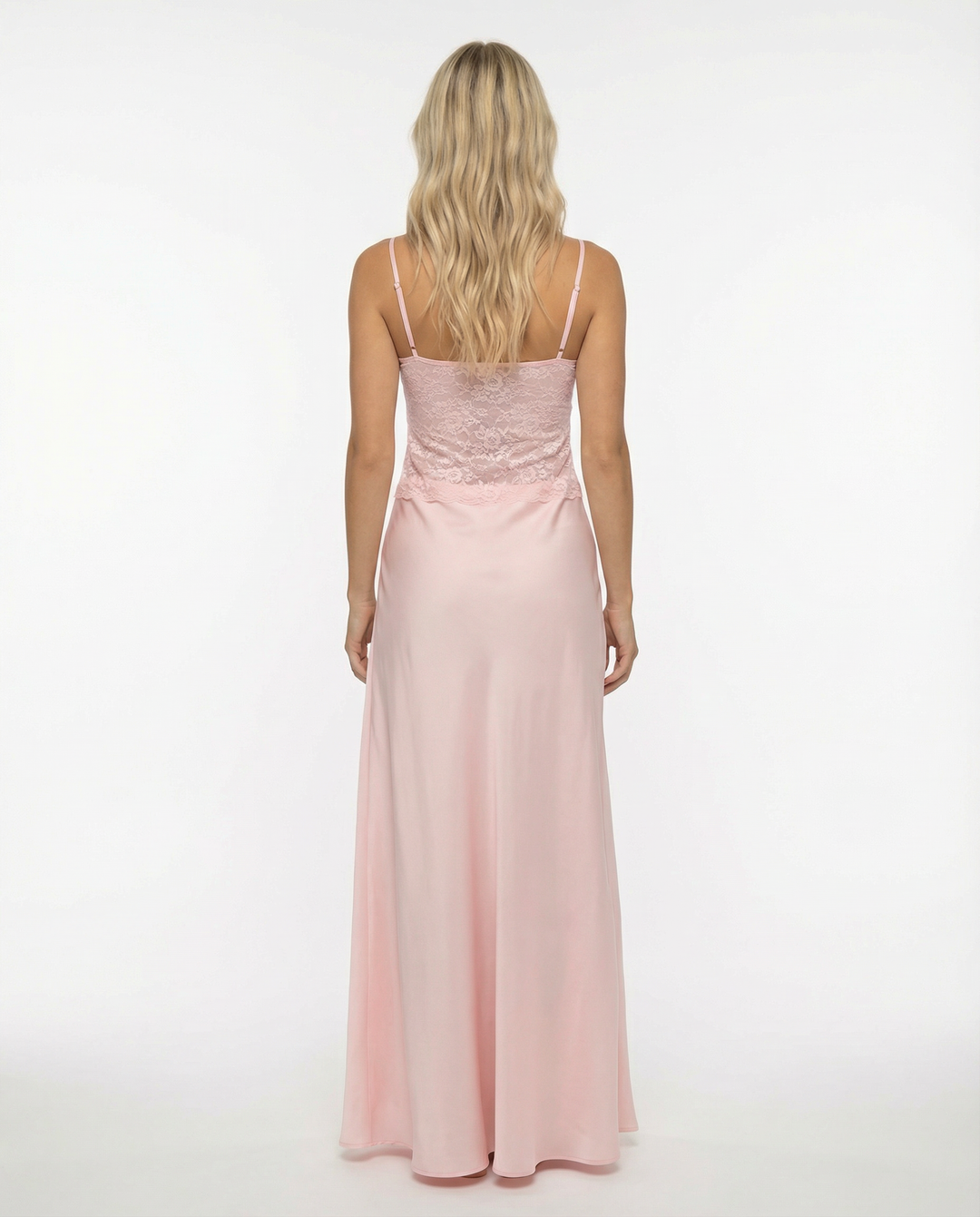 Female model in a yellow maxi dress with adjustable straps and a flowing skirt on a plain background.