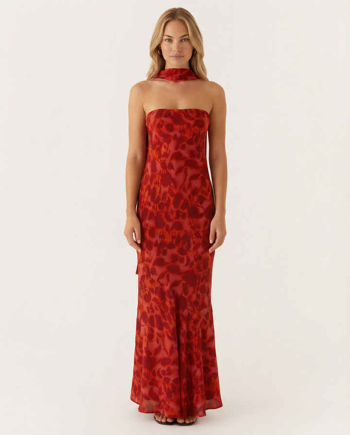 Female model wearing a strapless maxi dress in a soft floral print.