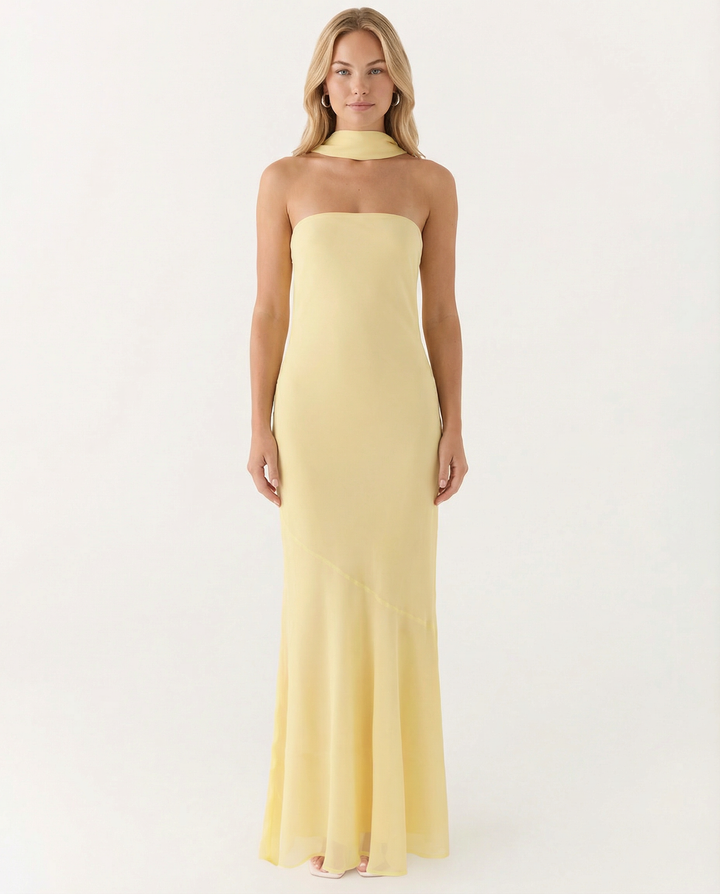 Female model in a strapless floral dress with soft movement.