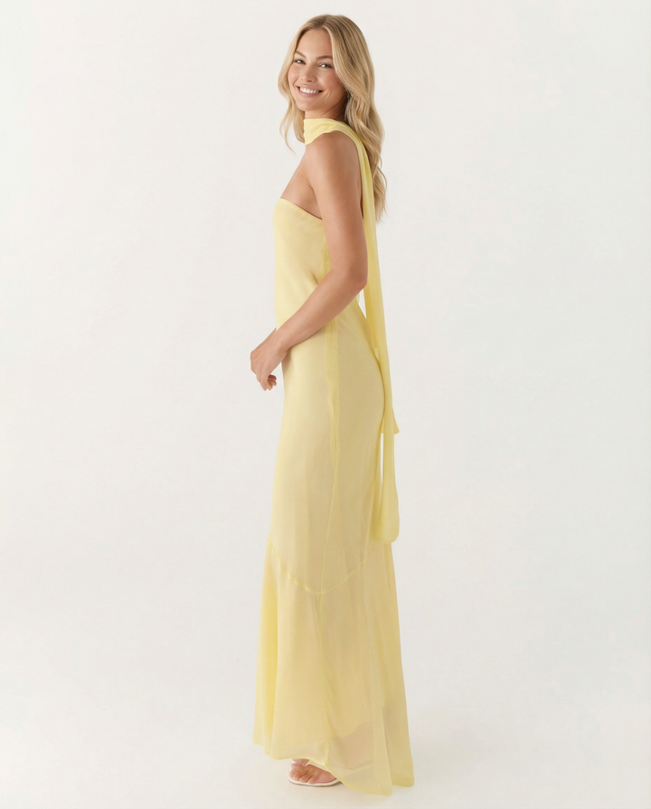 Female model styled in a floral strapless maxi dress.