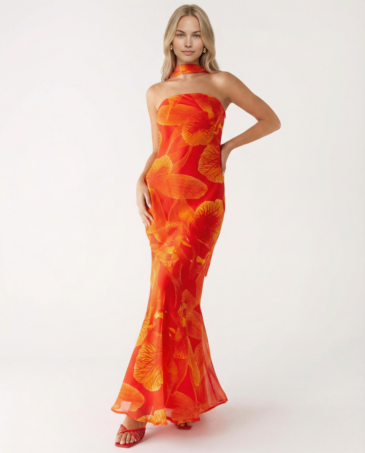 Woman wearing a garden party floral dress with a flowing silhouette.