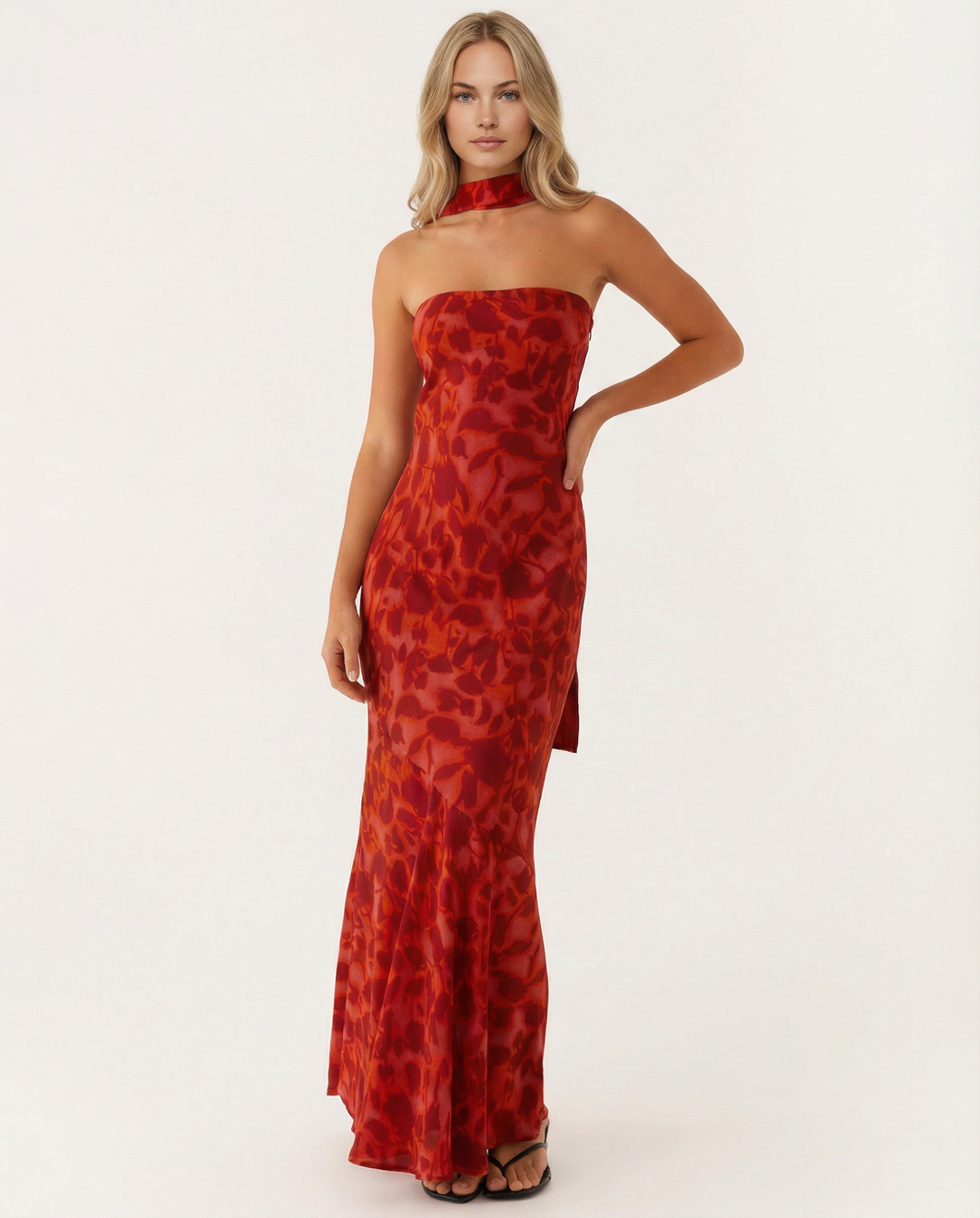 Female model wearing a warm-weather floral maxi dress on a plain background.